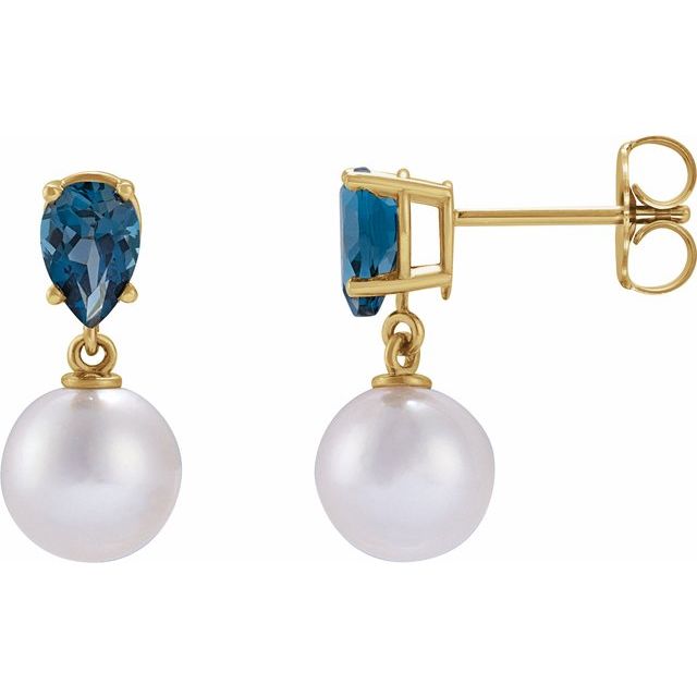 14k yellow gold pearl and blue topaz drop earrings — worn on ear