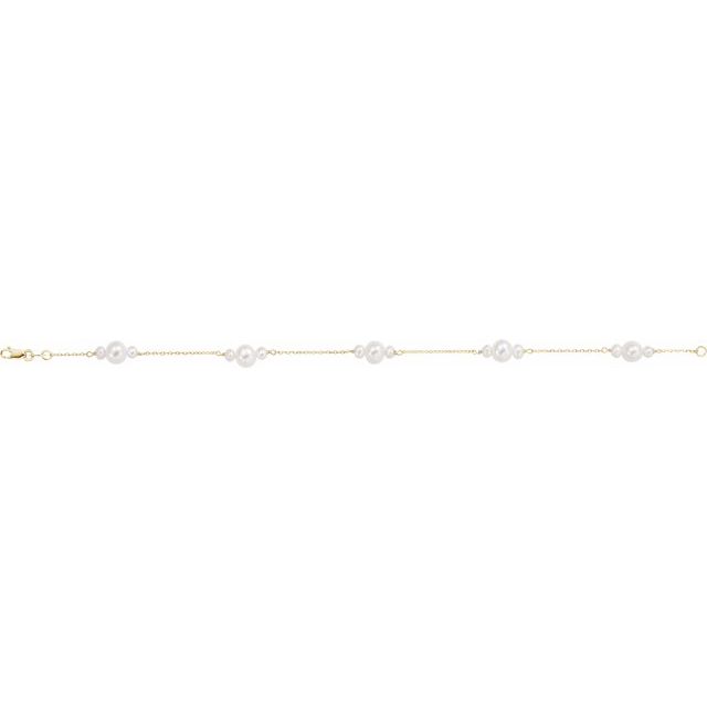 14k yellow gold pearl accent bracelet — worn on wrist