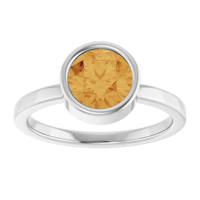 14k yellow gold citrine bezel ring — styled on hand