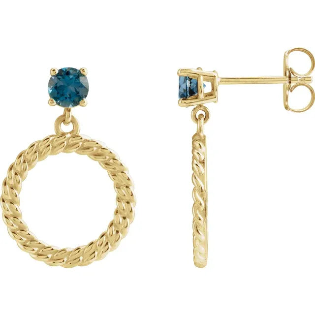 14k yellow gold blue topaz curb chain drop earrings — worn on ear