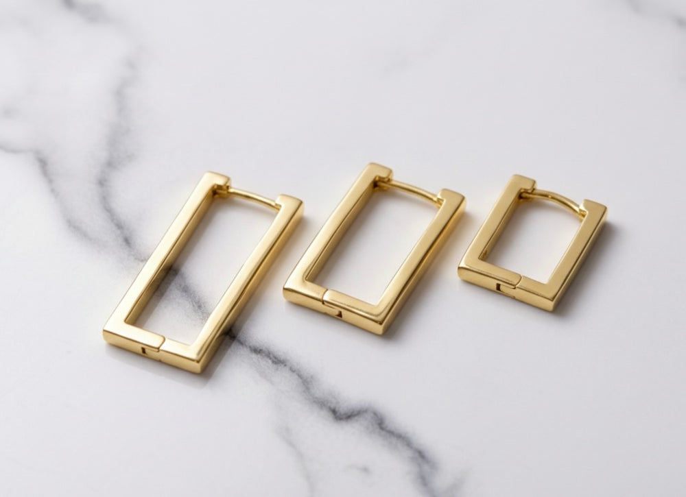 Sterling silver geometric clicker hoop earrings — lifestyle styled