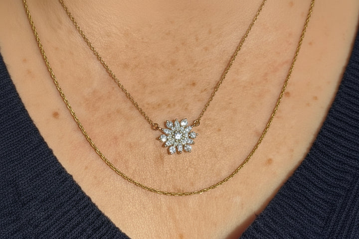 14k yellow gold snowflake diamond pendant necklace — close-up
