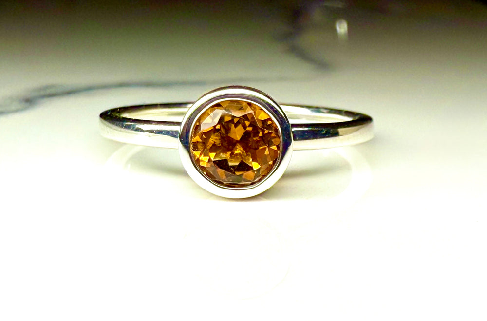 14k yellow gold citrine bezel ring — worn on hand
