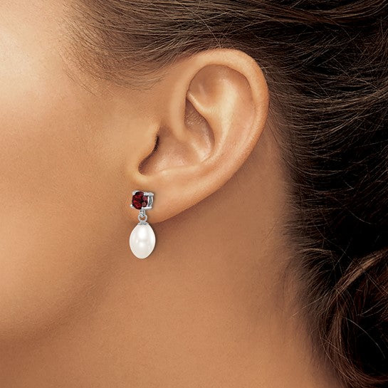 Sterling silver pearl droplet earrings — styled view