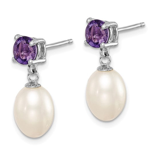 Sterling silver pearl drop earrings — angled view