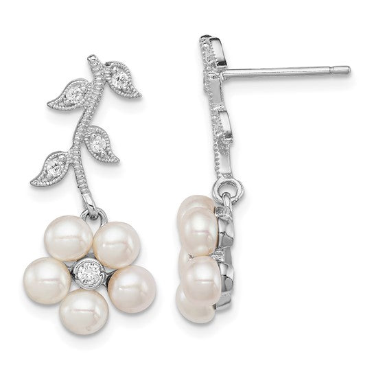 Sterling silver pearl floral drop earrings — worn on ear