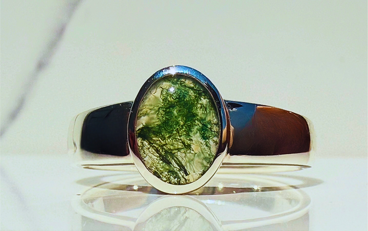 14k yellow gold low-profile moss agate ring — styled